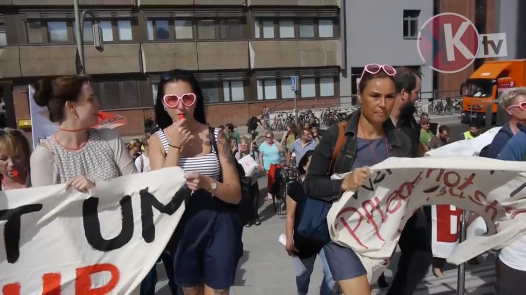 [Videoreportage] Charité: Krankenpfleger*innen im Rosa-Brillen-Warnstreik
